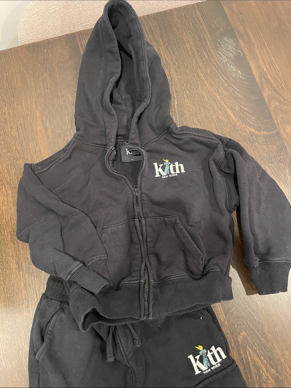 Kith Kids Black Zip Hoodie with White Logo and Yellow Accent